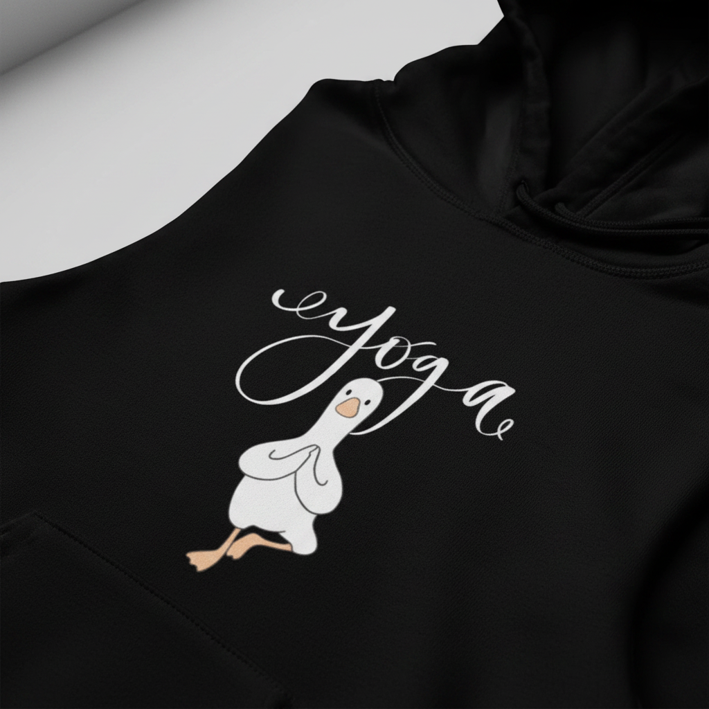 Black yoga duck pose hoodie close-up with white script and duck graphic