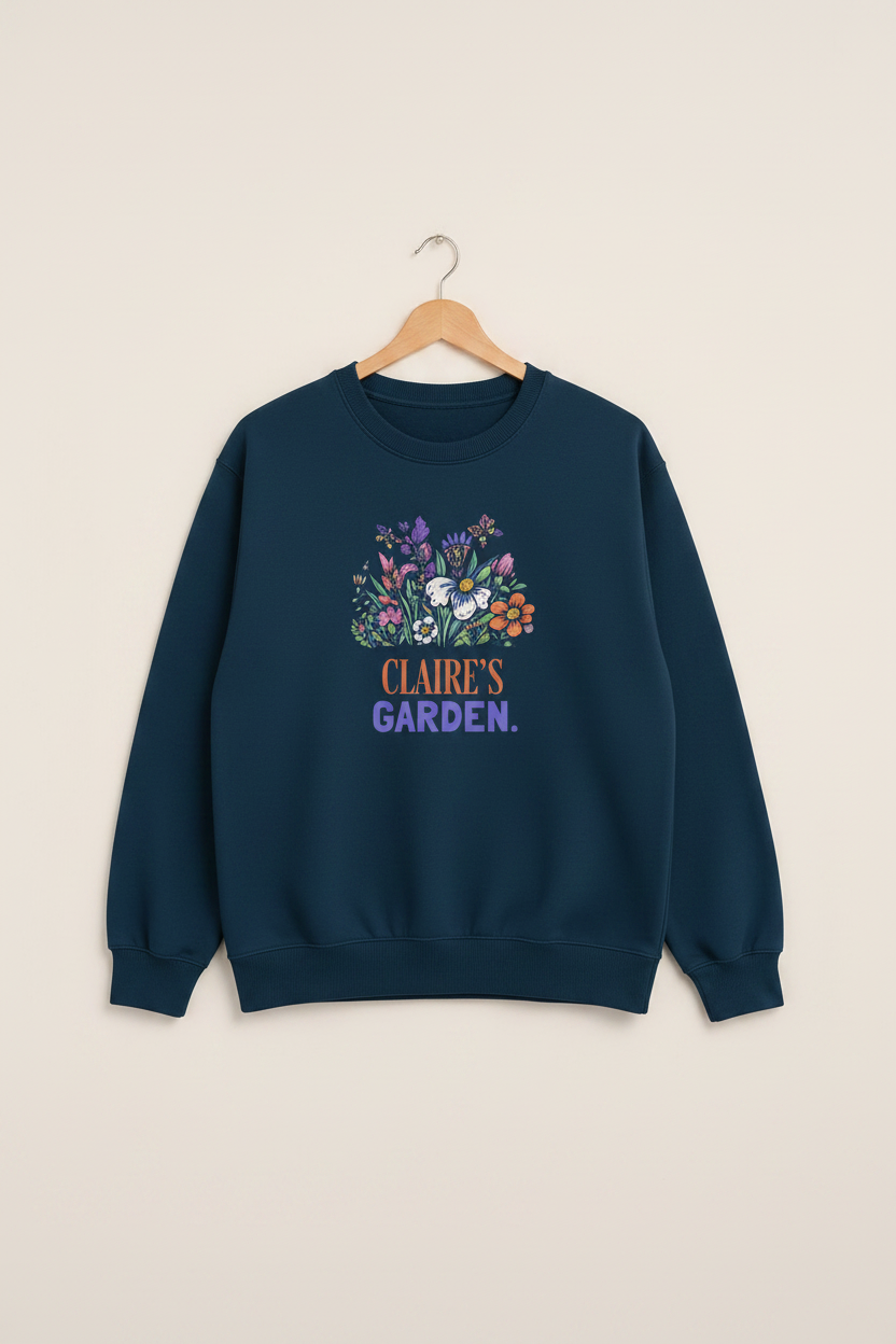 Navy crewneck sweatshirt with floral “Claire's Garden” name print on front