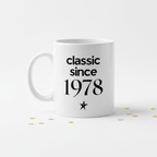 Ceramic coffee mug with “classic since 1978” text and star on white