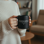 Black coffee mug with "THERAPIST" and "Est.2025" plus heart beneath