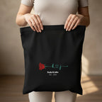 Black personalized rose tote bag close-up with red rose and 'Katie&Jake' text
