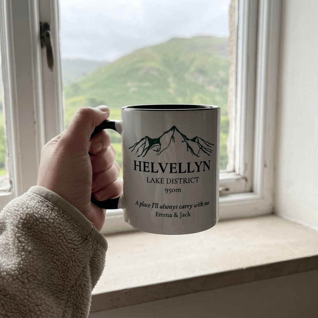 Close-up Helvellyn mug held beside a cottage window