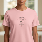 Pink crew-neck T-shirt with “GOOD ENERGY ONLY” graphic centered on the chest