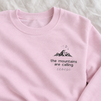 Close-up of pink Mountains Are Calling sweatshirt with Eloise