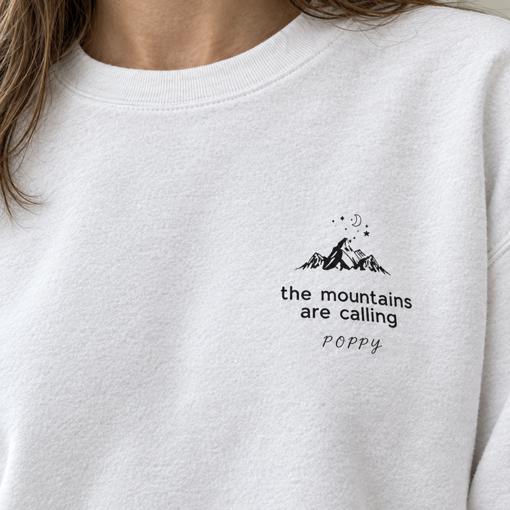 Close-up white Mountains Are Calling sweatshirt with Poppy