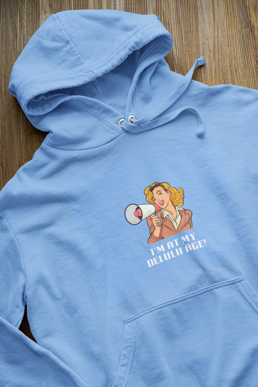 Light blue hooded sweatshirt with front pocket and chest graphic, drawstring hood