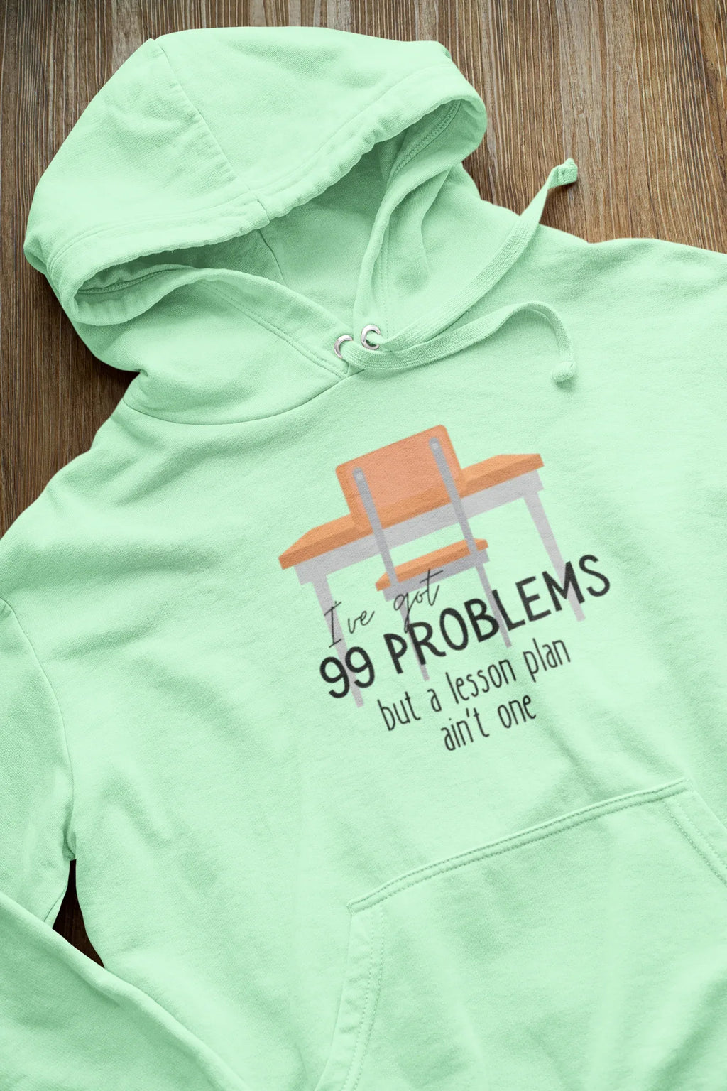 Mint green unisex hoodie with drawstring hood and kangaroo pocket; '99 problems' print.