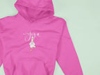 Pink hoodie close-up with duck pose chest logo