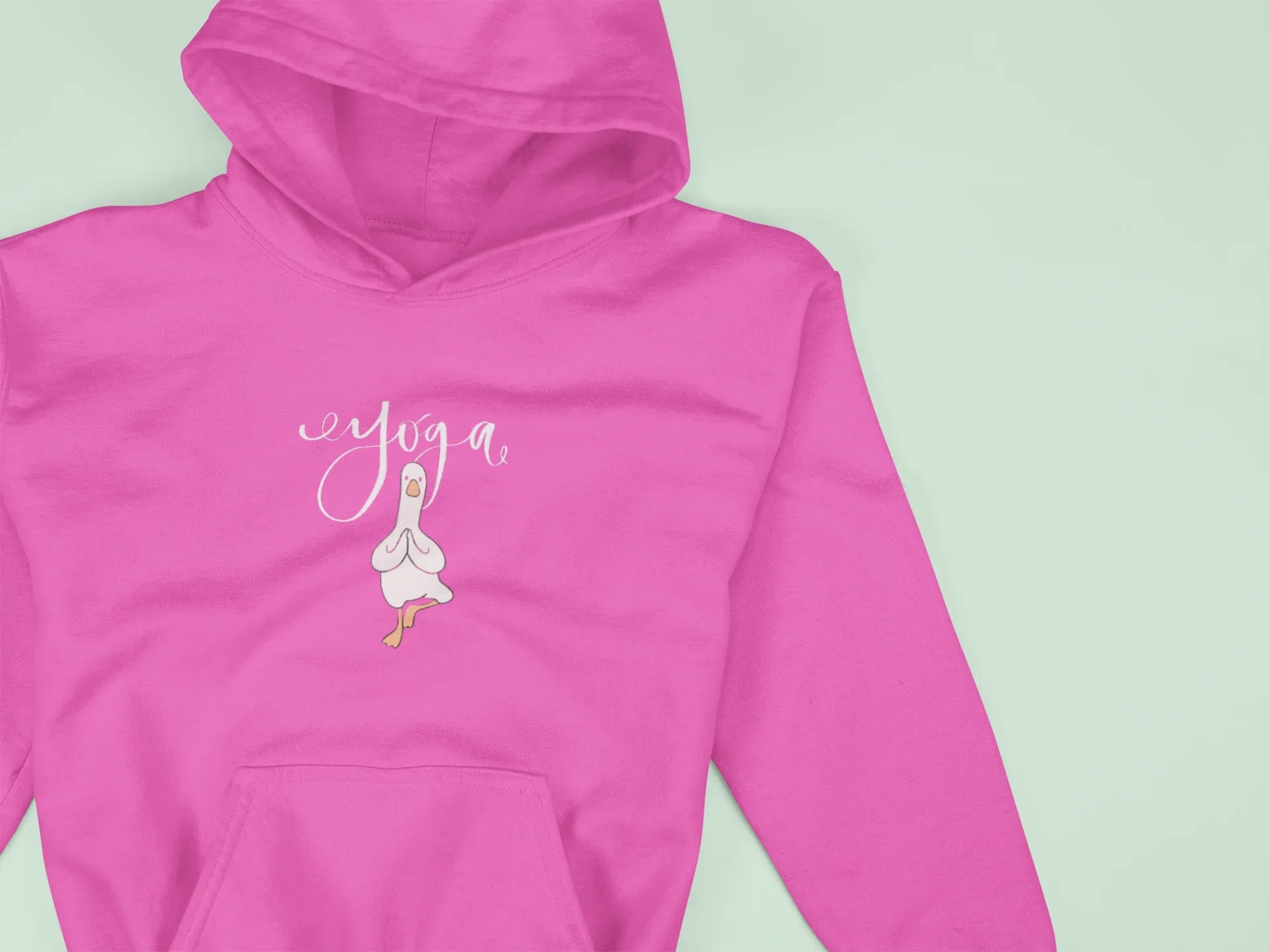 Pink hoodie close-up with duck pose chest logo