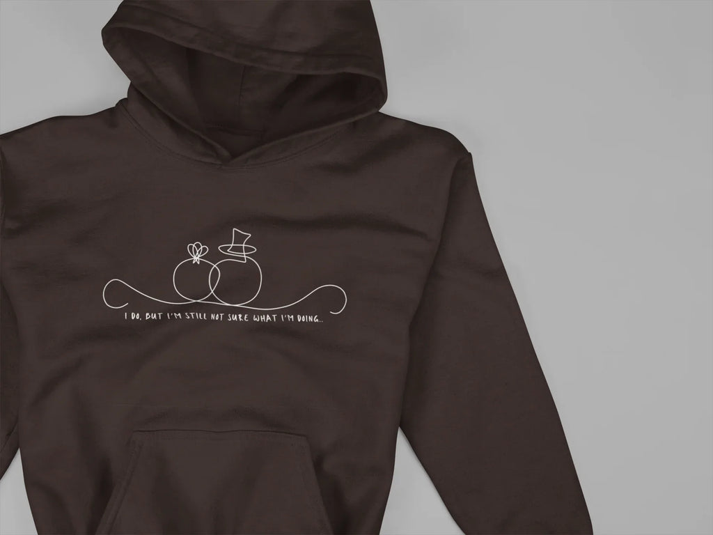 Dark brown unisex hoodie close-up, hood and pouch pocket with front line-art wedding graphic
