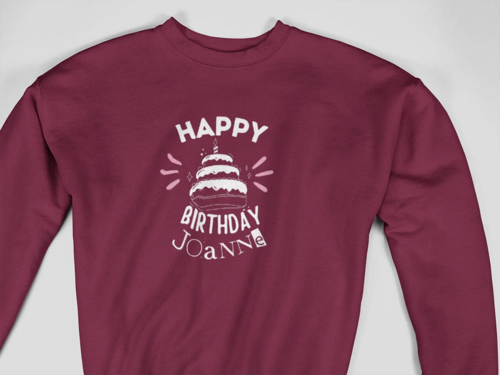 Maroon crewneck sweatshirt with “Happy Birthday Joanie” cake graphic