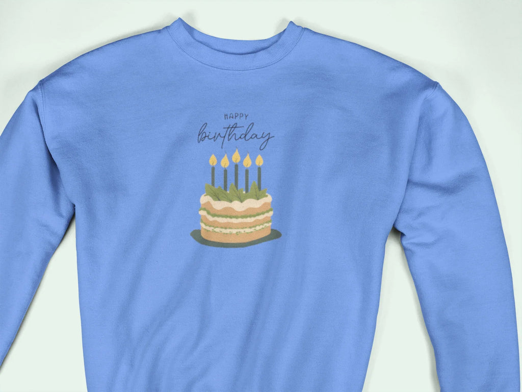 Light blue crewneck sweatshirt with “Happy birthday” cake and candle graphic