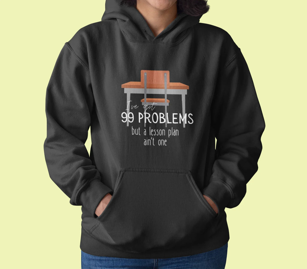 Dark charcoal unisex hoodie with drawstring hood and front pocket; '99 problems' desk graphic.
