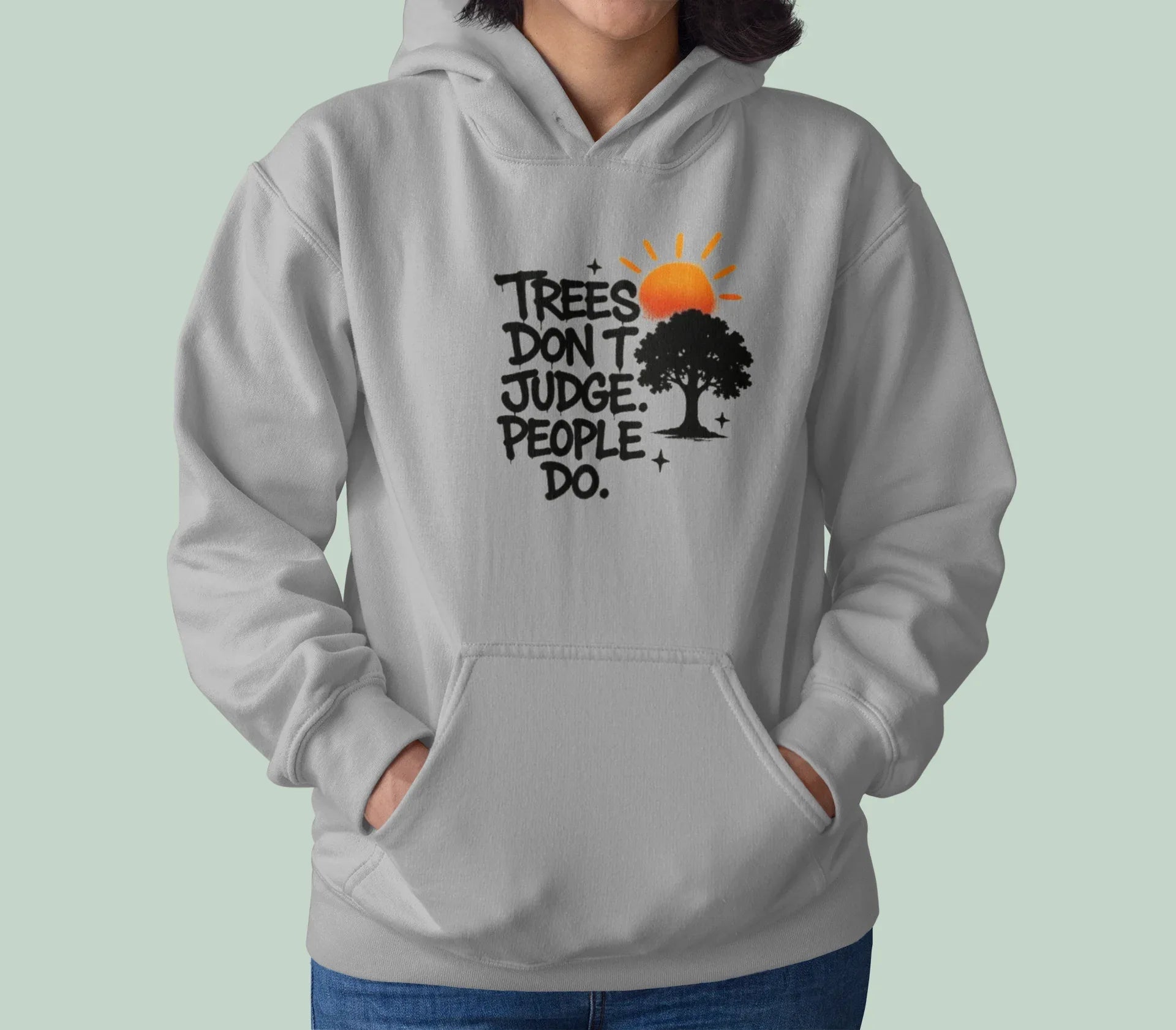 Sport grey hoodie worn by a model, with chest graphic of tree and text