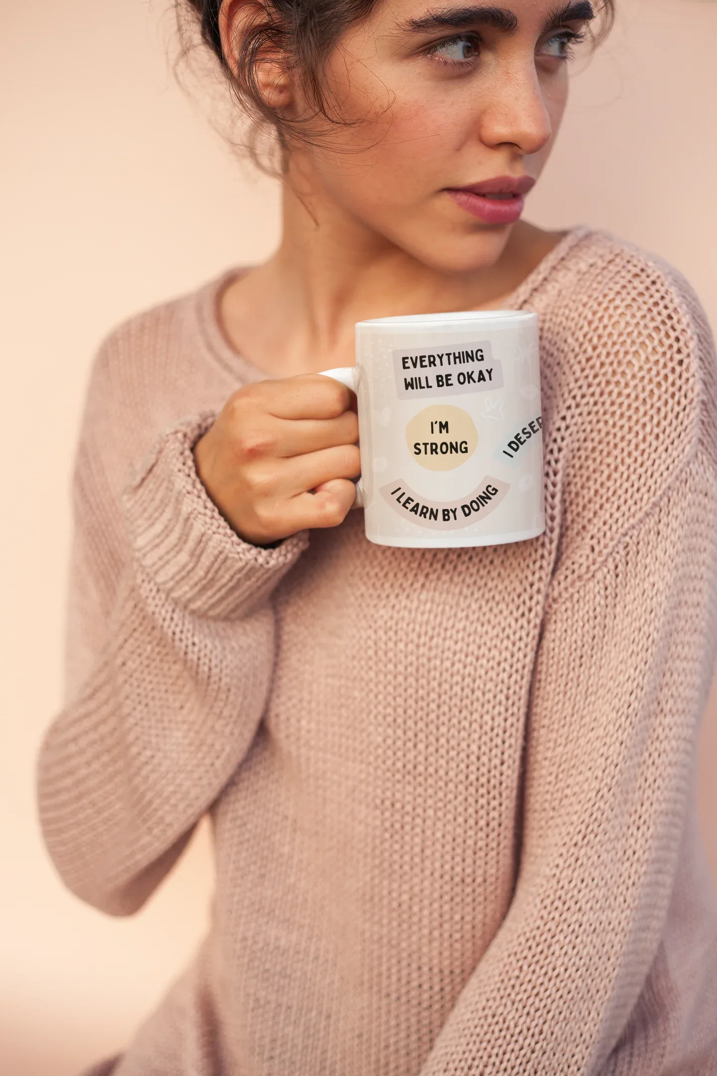 White ceramic positivity mug with 'Everything will be okay' and 'Learn by doing' text