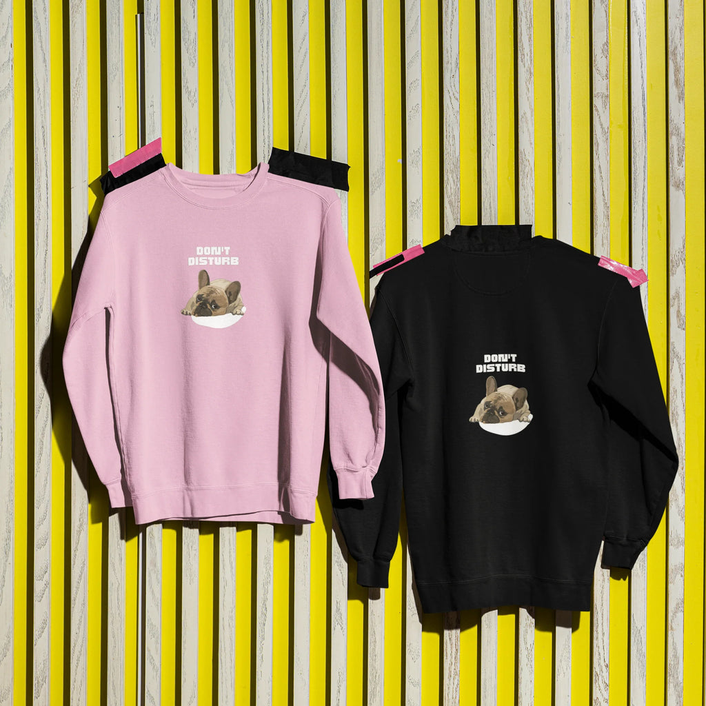 Dusty pink and black sweatshirts, each with “DON’T DISTURB” text and sleeping French Bulldog.