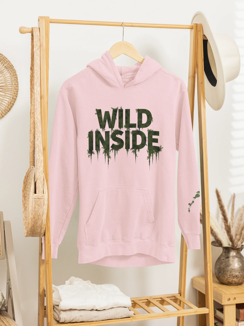 Light pink hoodie with 'WILD INSIDE' front graphic, hood and long sleeves