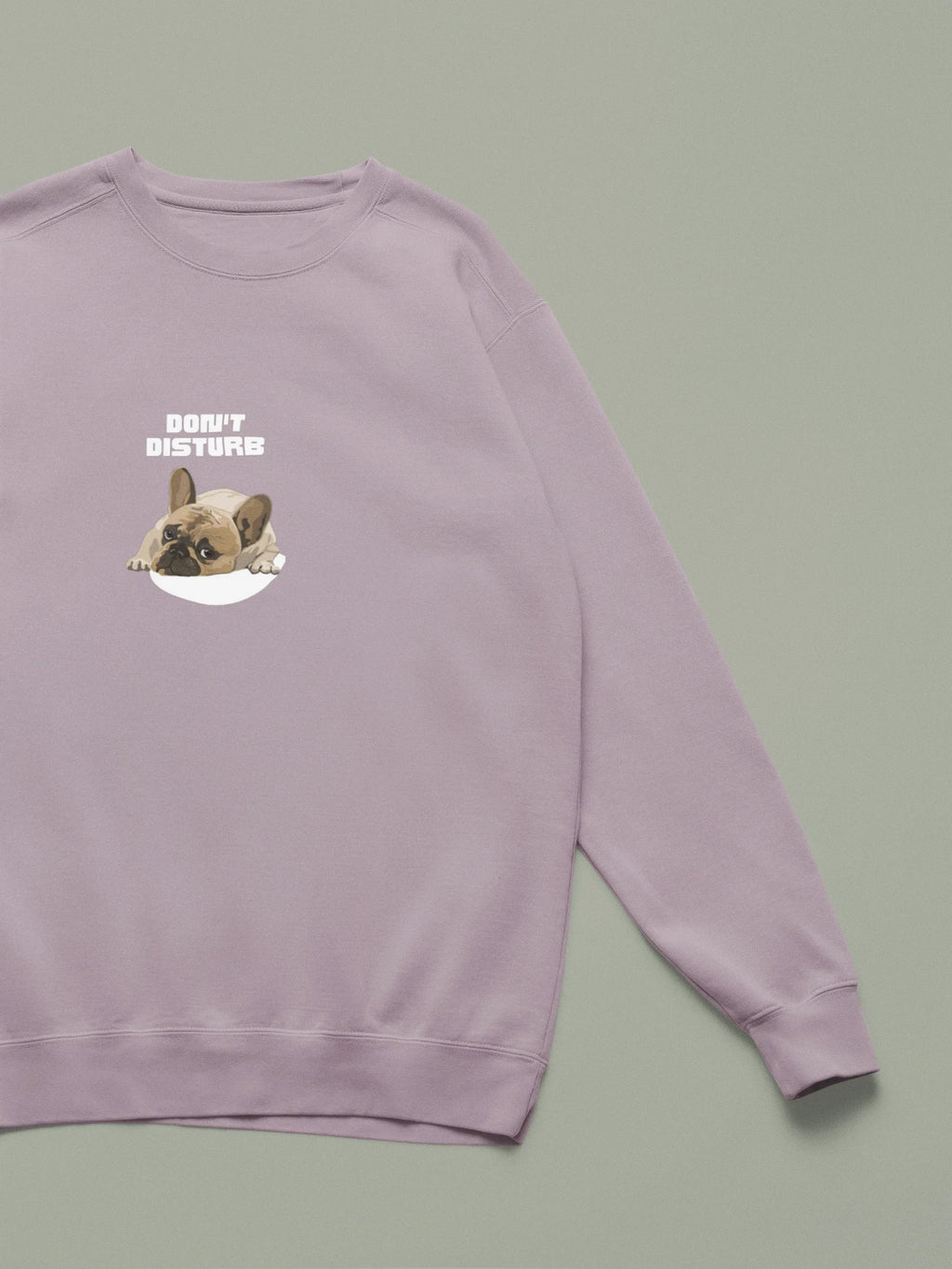 Dusty pink sweatshirt with “DON’T DISTURB” text and sleeping French Bulldog graphic.