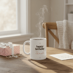 White ceramic mug with “happy birthday” and name Sarah in pink script