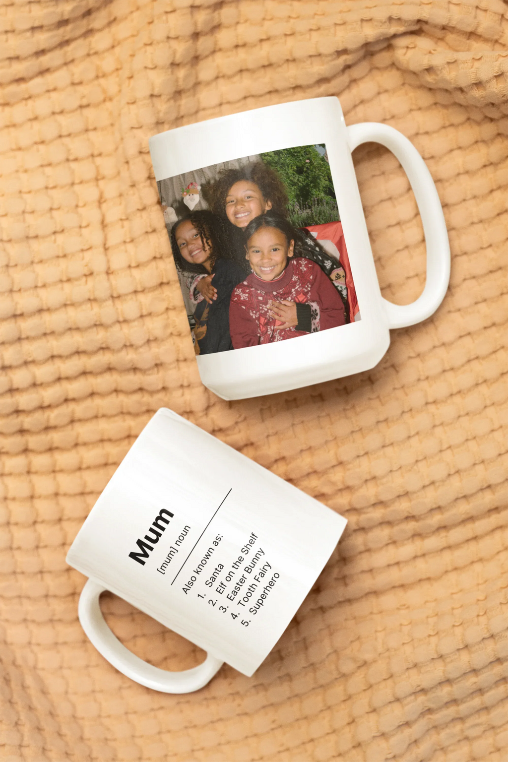 White ceramic mug with custom family photo and a second mug showing “Mum” text