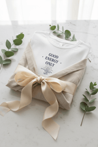 White T-shirt with 'Good Energy Only' graphic on the chest, short sleeves