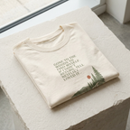 Natural off-white hiking T-shirt with pine tree graphic and quote text