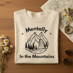 Ivory T-shirt with black 'Mentally In the Mountains' mountain graphic front