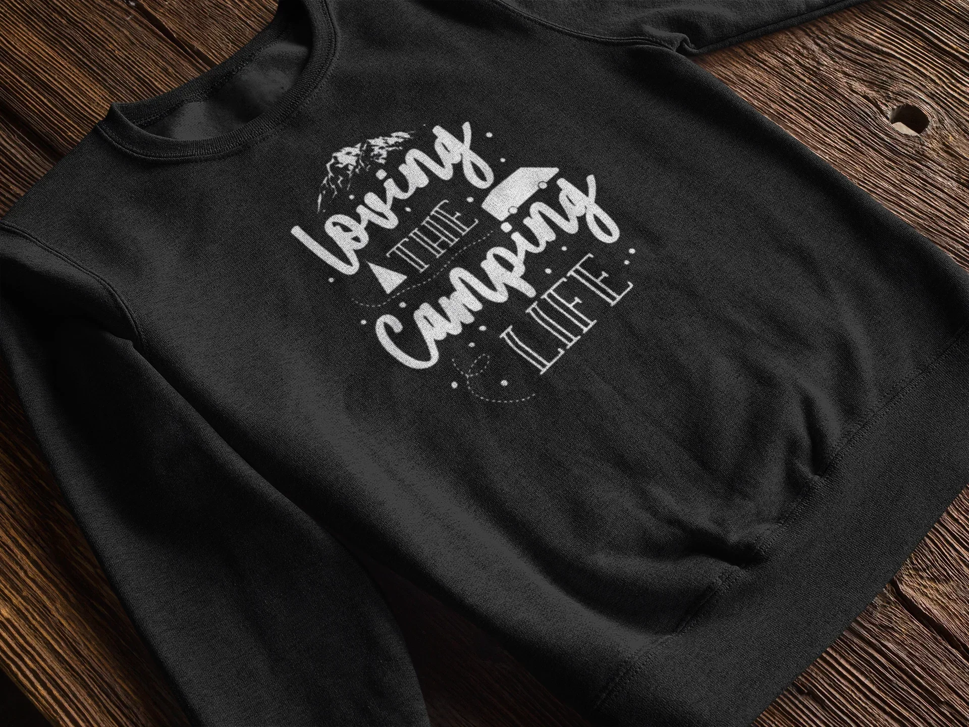Black sweatshirt laid flat with white "Loving the Camping Life" graphic
