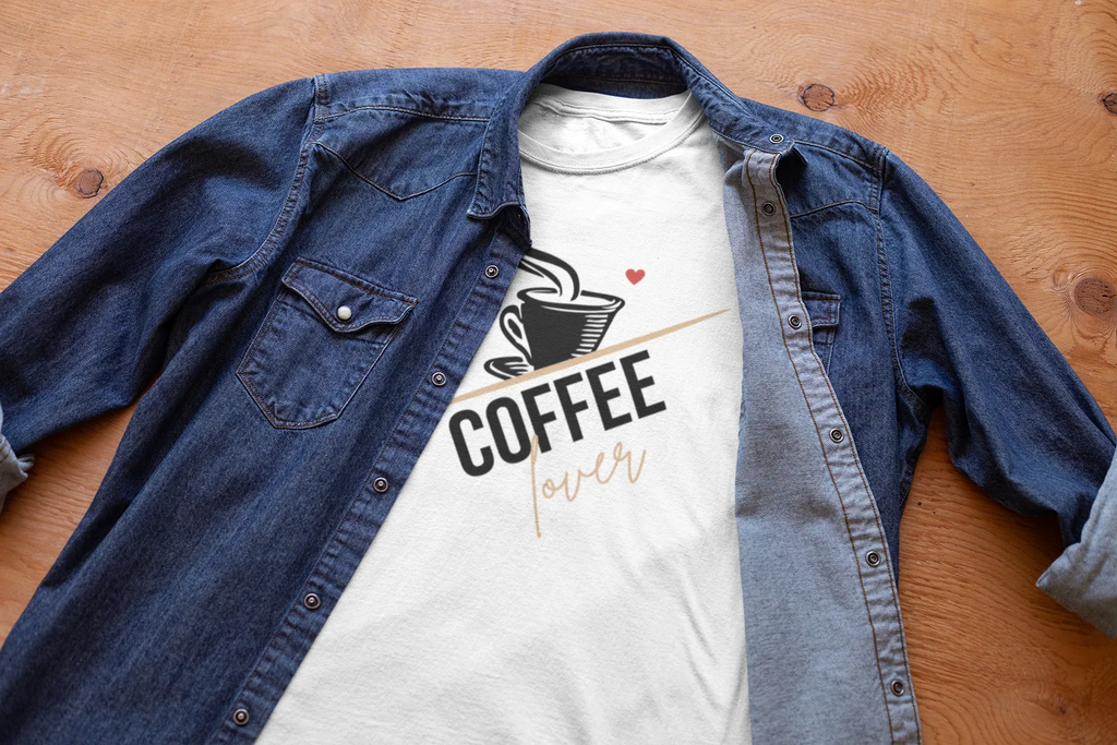 White unisex cotton T-shirt with coffee cup graphic under a blue denim button-up shirt