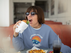 Light blue crewneck sweatshirt with circular space graphic on the chest