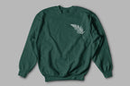 Forest green sweatshirt with a white feathered leaf graphic on the chest.
