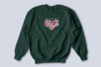 Forest green sweatshirt with “BIRTHDAY GIRL” text and floral heart graphic