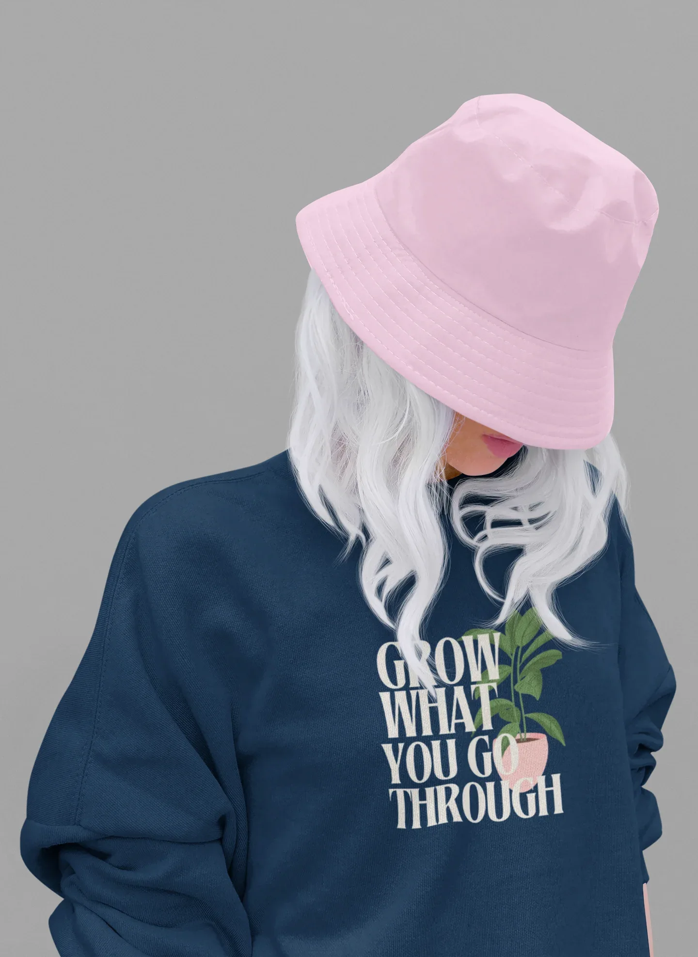 Navy crewneck sweatshirt with “Grow What You Go Through” graphic and green leaf