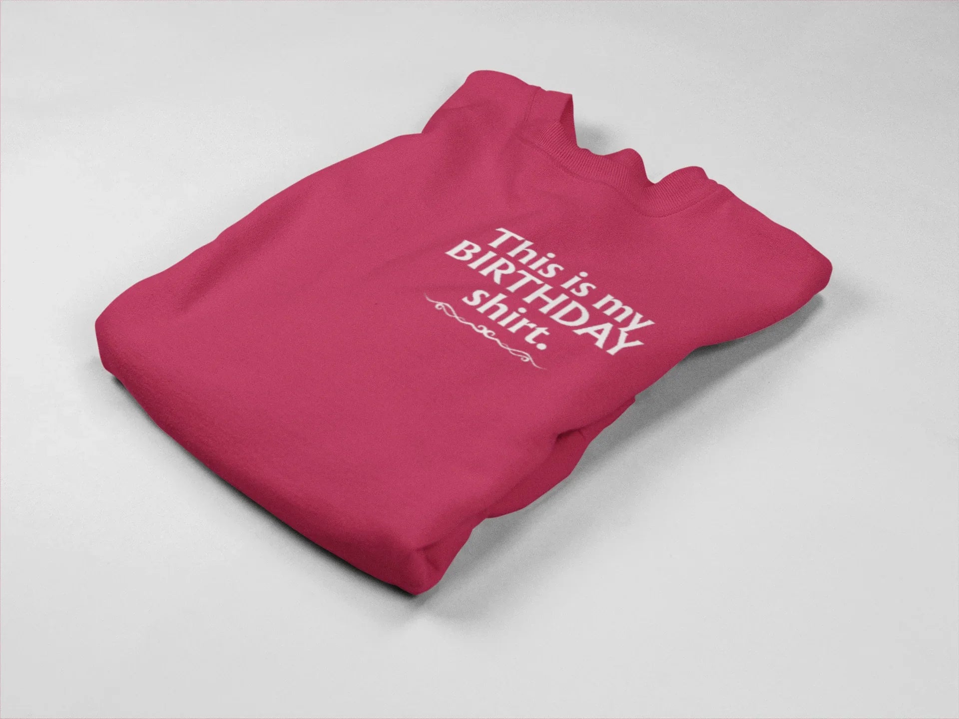Pink crewneck birthday sweatshirt with printed “This is my BIRTHDAY shirt”