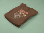 Dark brown crewneck sweatshirt with floral quote graphic, folded flat view