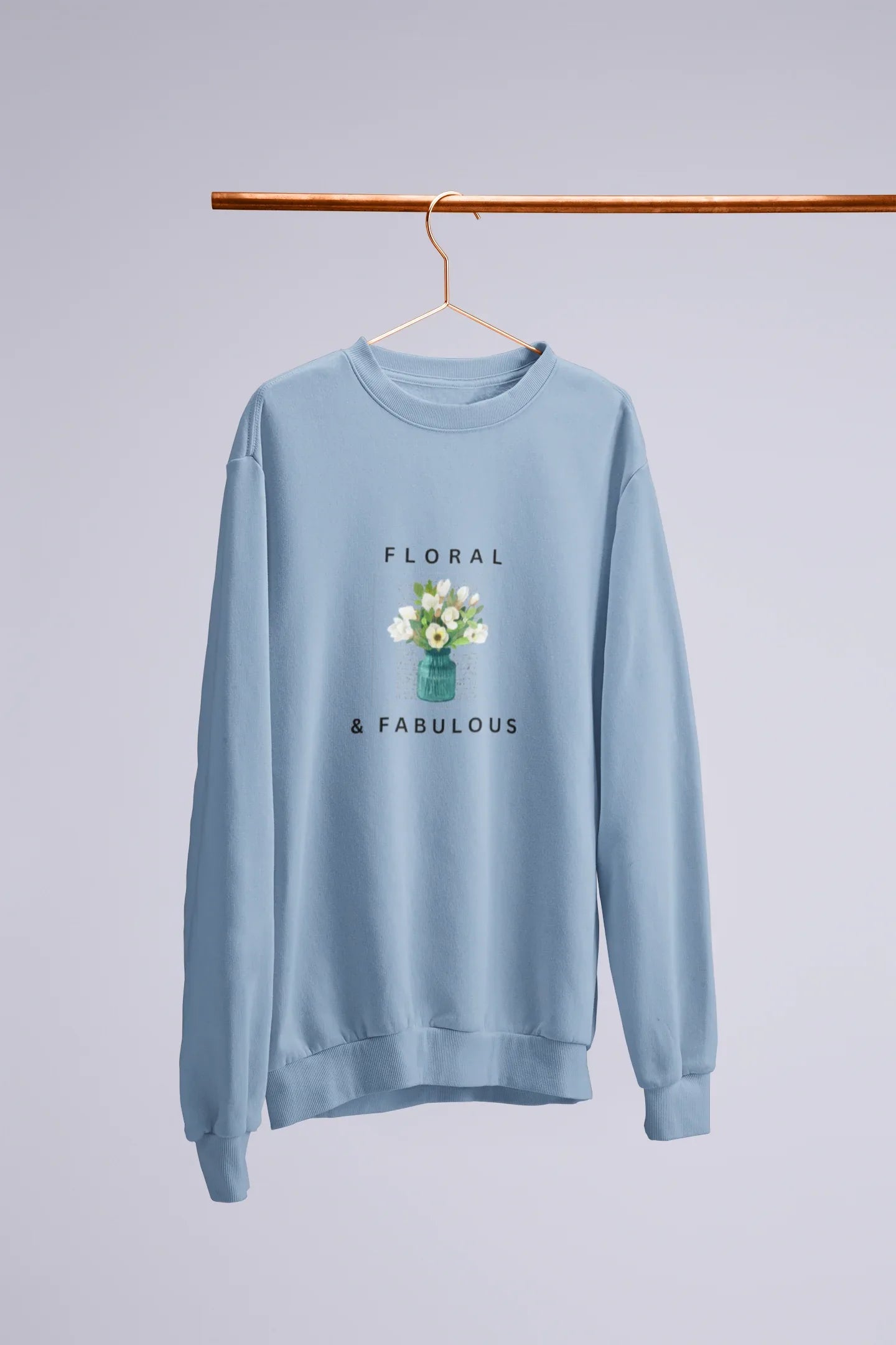Light blue sweatshirt with small floral bouquet in vase graphic and 'Floral & Fabulous' text