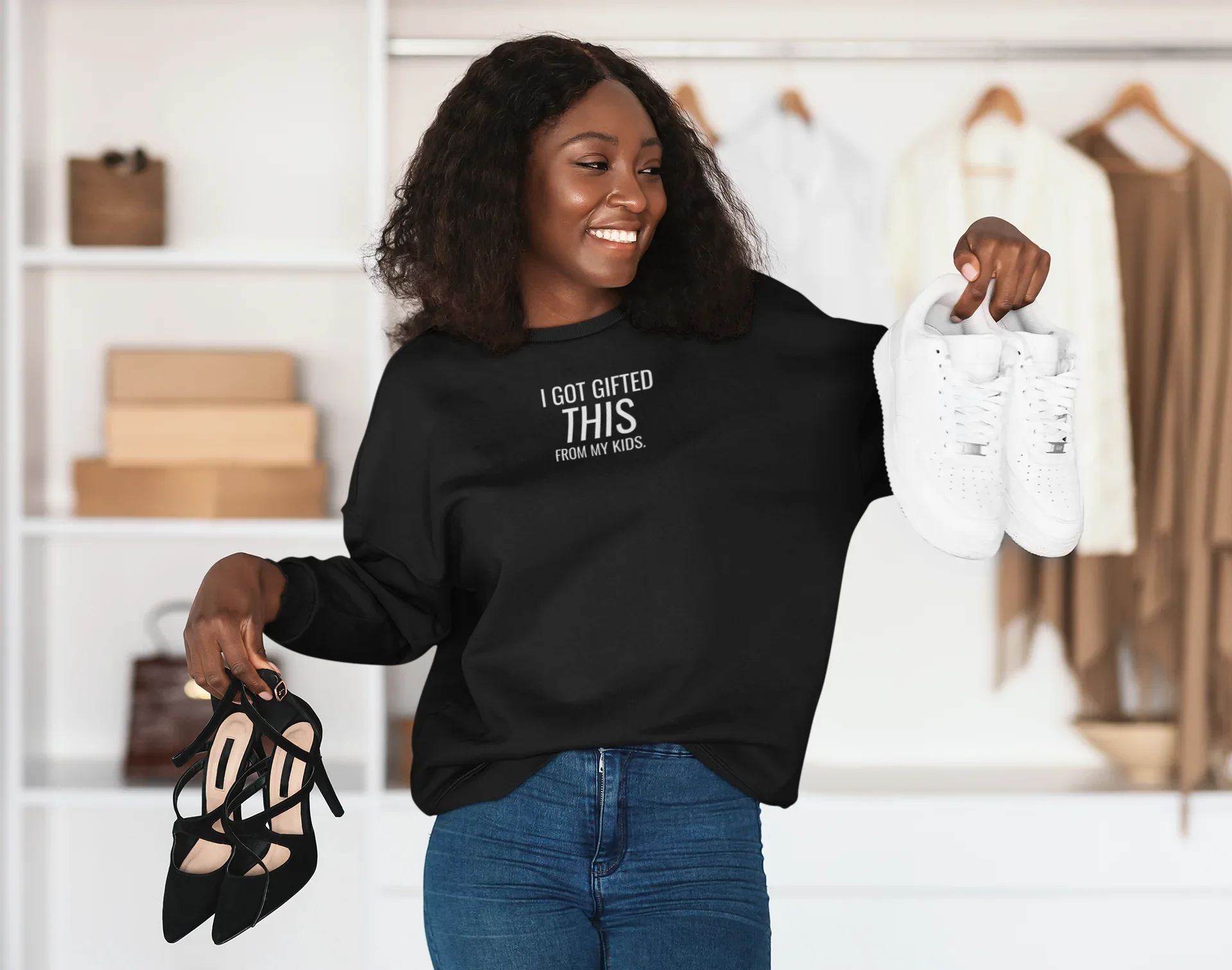 Women's black crewneck sweatshirt with 'I got gifted this from my kids' chest text print