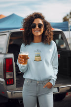 Light blue sweatshirt with birthday cake and candle graphic on the chest