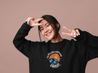 Black crewneck sweatshirt with circular planet graphic and “Orbit!” wordmark