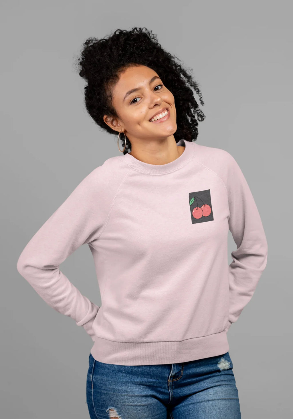 Light pink crewneck sweatshirt with cherry embroidery patch on the left chest