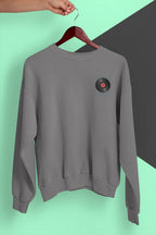 Dark heather crewneck sweatshirt with embroidered record player patch on chest