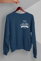 Blue crewneck sweatshirt with long sleeves and travel-themed chest logo graphic