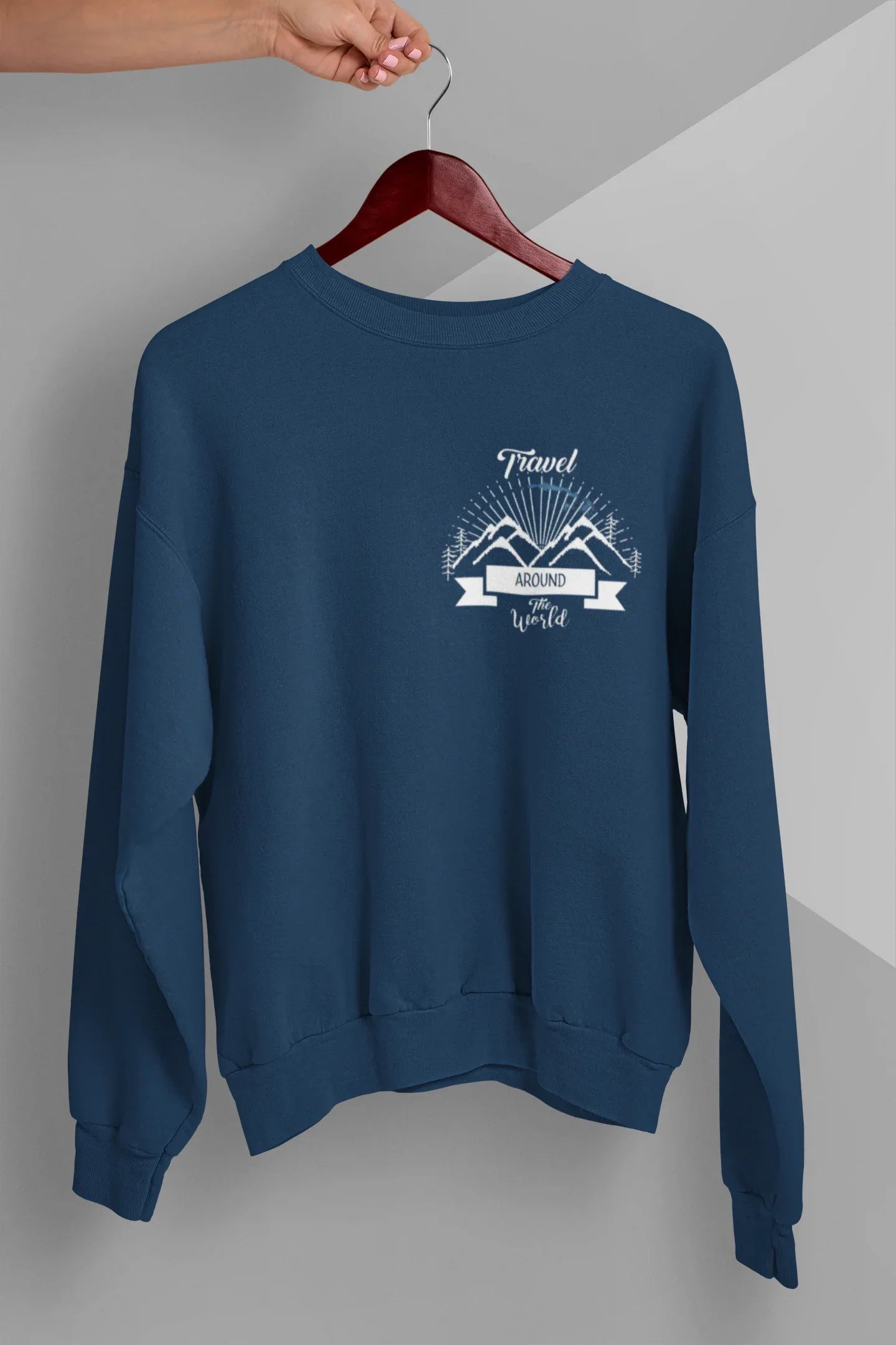 Blue crewneck sweatshirt with long sleeves and travel-themed chest logo graphic