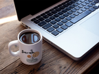 White ceramic mug with Sarah name and floral pot graphic, filled with coffee
