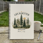 Dad notebook personalised with Theo and Ivy on a garden table