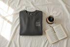 Charcoal gray crewneck sweatshirt with chest logo