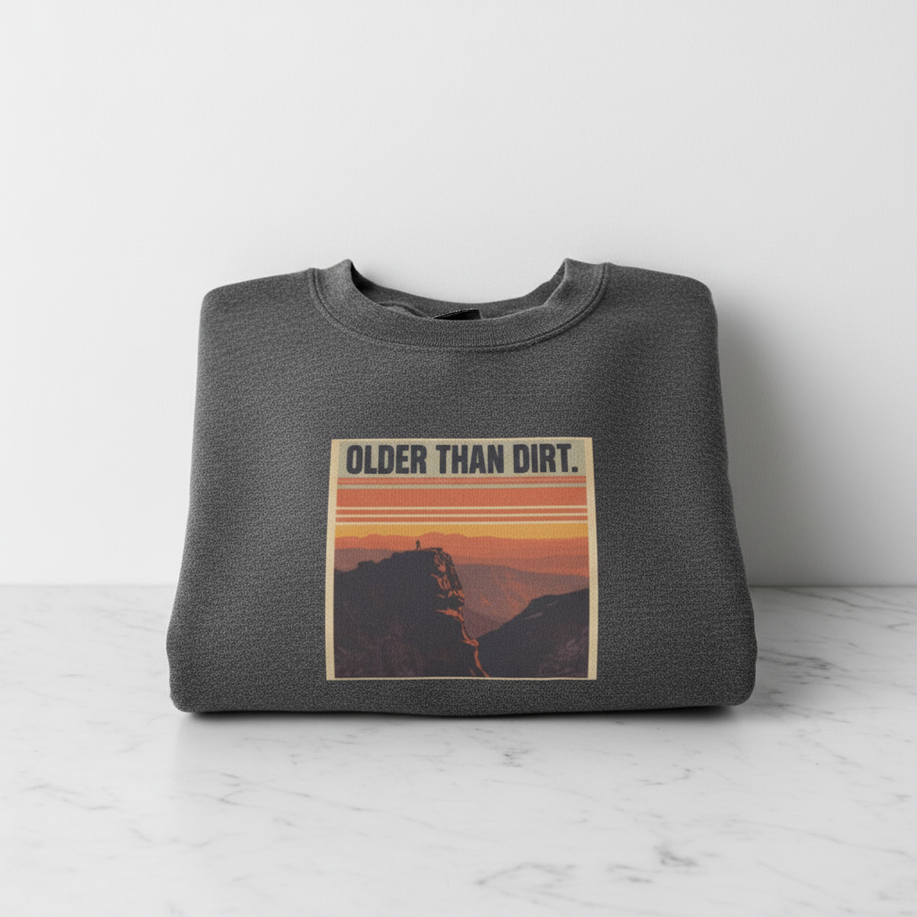 Dark heather crewneck sweatshirt with mountain sunset graphic on the chest