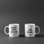 Two white ceramic coffee mugs side by side: “classic since 1978” and “still iconic”
