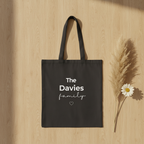 Black canvas tote bag with “The Davies family” text and heart icon