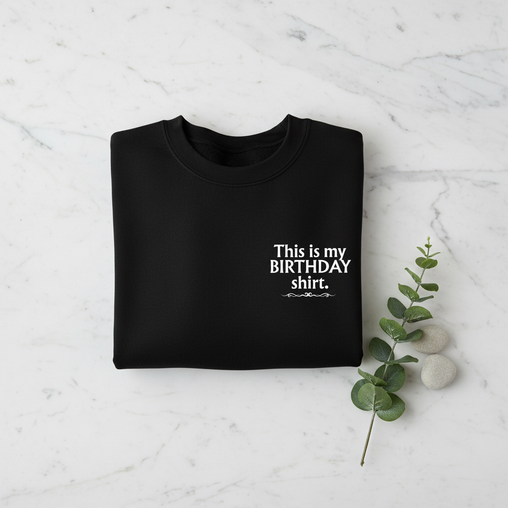 Black crewneck birthday shirt with “This is my BIRTHDAY shirt” print.